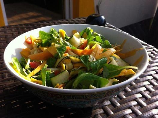 Corn sald, butternut, radish, carrot, zuchini with avocado and tomatoes massaged in